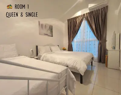 a bedroom with two beds and a window at ICC Suites Ipoh 202A by H2H in Ipoh