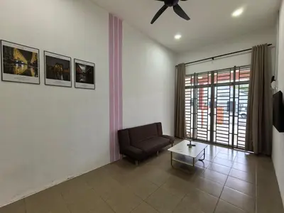 a living room with a couch and a ceiling fan at Suite Karangan Near Inokom in Titi Karangan
