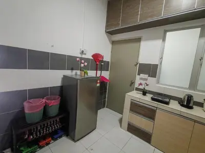 a kitchen with a stainless steel refrigerator with flowers on it at ZE VI Homestay,Tanah Rata in Tanah Rata