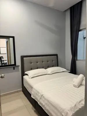 a bedroom with a large white bed with a mirror at AYAAN GAMING HOME at Quintet Play Free GranTurismo in Tanah Rata