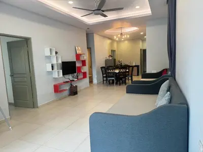 a living room with a couch and a dining room at AYAAN GAMING HOME at Quintet Play Free GranTurismo in Tanah Rata