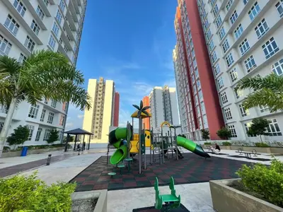 a playground in the middle of a city with tall buildings at Arrisa Guest House d'Anderson Ipoh Perak in Kampong Kepayang