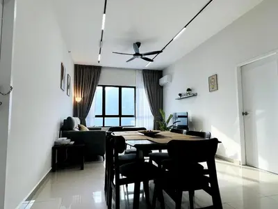 a living room with a table and a couch at Sunshine Residence Kekloksi View 2R 4pax in Ayer Itam