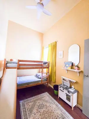 a bedroom with two bunk beds and a rug at Mossy Forest Family Retreat V, Kea Farm, 2-8 guests, Keafarm, Cameron Highlands in Cameron Highlands