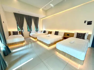 a hotel room with two beds and two windows at LYL EvenHill Private Pool-18-23pax 5BR in Ipoh