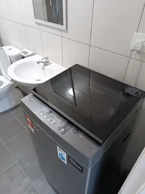 a bathroom with a sink and a toilet and a sink at The Sun condo at taman sri nibong ,near queenbaymall in Bayan Lepas