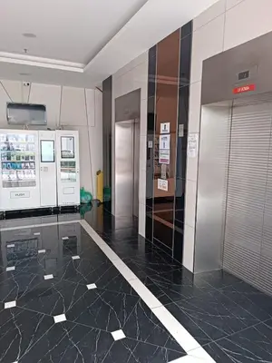 a lobby with two elevators in a building at The Sun condo at taman sri nibong ,near queenbaymall in Bayan Lepas