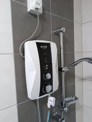 a soap dispenser on a wall in a bathroom at The Sun condo at taman sri nibong ,near queenbaymall in Bayan Lepas