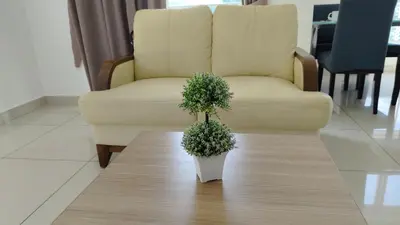 a plant on a coffee table in front of a chair at High-Rise Suite with view-Near Gurney & Gleneagles in George Town