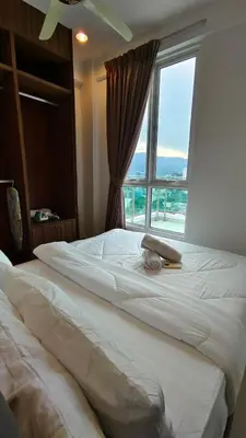 a large bed in a bedroom with a window at High-Rise Suite with view-Near Gurney & Gleneagles in George Town