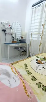 a room with a table and a rug on the floor at HEE & PENNIE House in Ipoh