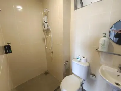 a bathroom with a shower and a toilet and a sink at Palas Horizon Kea Farm 2-9 pax 180 View Cameron in Brinchang