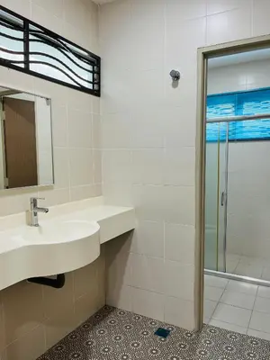 a bathroom with a sink and a shower at Sofea Homestay Ipoh V2 in Ipoh
