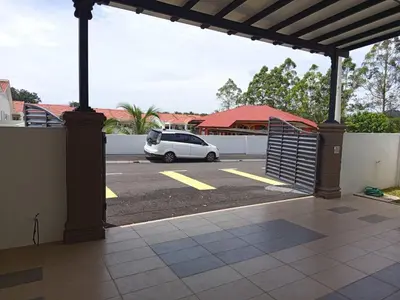 a white car parked in a parking lot at Iman4 Homestay in Kampung Behrang