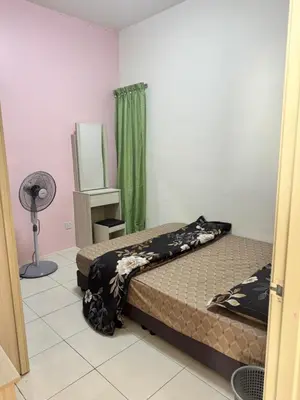 a bedroom with two beds and a fan at AYAAN LAVISH PRIMA APARTMENT FREE WiFi in Tanah Rata