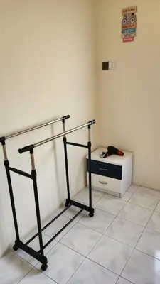 a room with a bed and a desk in it at Vacation Ipoh Homestay for 12 Pax 4 Bedrooms for Delicious Food in Ipoh