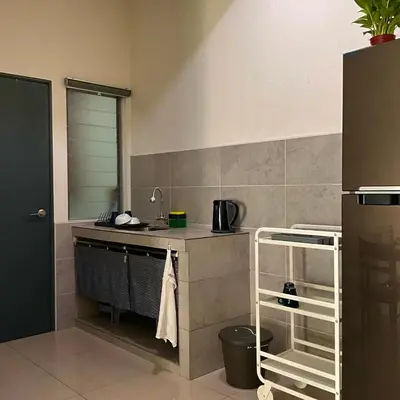 a kitchen with a sink and a counter top at The Bay 6pax 2BR Apartment at Town Centre in Ipoh