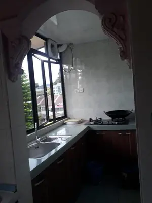 a kitchen with a sink and a window at Camlodge apartments in Tanah Rata