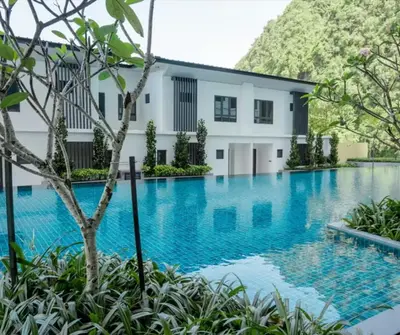 an image of a swimming pool in front of a building at Sunway Onsen Suites in Tambun