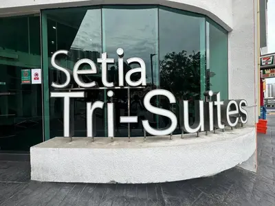 a sign on the side of a building at 2BR Lively City View Family Suite#Airport in Bayan Lepas