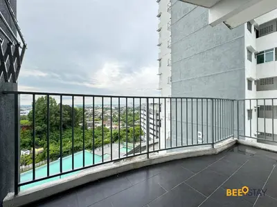 a balcony with a view of a building at Taiping Crystal Creek Condo Pool Gym Netflix in Taiping