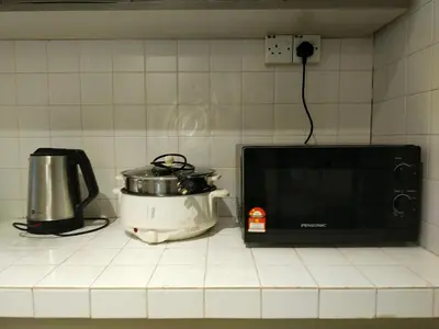 a microwave and a toaster on a kitchen counter at 193 Breeze Single Terrace 3BR2B 10pax in Ipoh