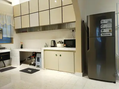 a kitchen with a stainless steel refrigerator in it at 193 Breeze Single Terrace 3BR2B 10pax in Ipoh