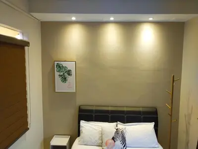 a headboard of a bed in a room at 193 Breeze Single Terrace 3BR2B 10pax in Ipoh