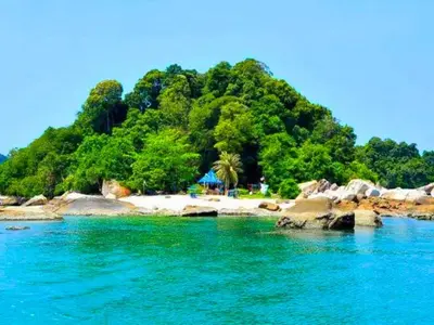 an island in the water with a beach and trees at Pangkor Island Pool View Studio 2 Queen Beds 2 Min Walk to the Beach Free WiFi & Parking in Pangkor