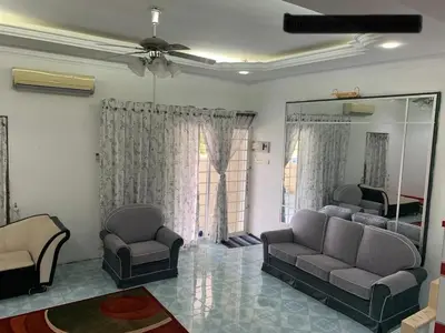 a living room with two couches and a mirror at Thind's Place in Kamunting