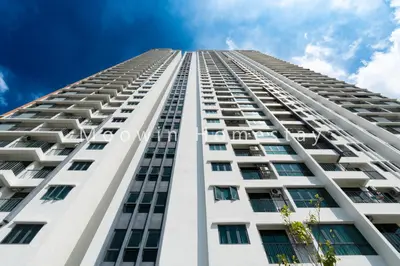a tall white building looking up at the sky at Summer Cozy Studio Room in Perai