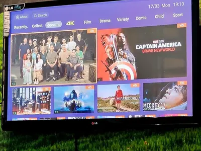 a television screen with a bunch of movies on it at Seaview and 5mins to Paddy Field and Beach in Sekincan