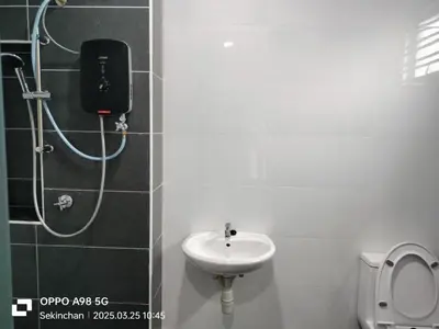 a bathroom with a shower and a sink and a toilet at PaddyView 2-storey Landed GuestHouse 15pax 4R3B \u7a3b\u7530\u4e2d\u592e\u6c11\u5bbf in Sekincan