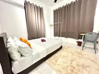 a bedroom with a bed with white sheets and a rug at CozySukun40#6pax#Netflix#NearIconCity#BukitMertajam in Bukit Mertajam