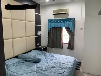 a bedroom with a bed and a window at Thind place in Kamunting