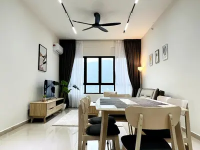 a dining room with a table and a ceiling fan at SunshineResidence 5pax Near Georgetown in Ayer Itam
