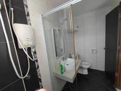 a bathroom with a shower and a sink and a toilet at 3B2BR Marina Height Seaview room Rose in Lumut