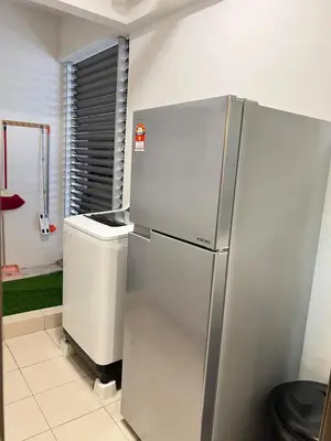 a refrigerator in a kitchen with a trash can at G Home 3 - Ipoh City Centre Majestic 2R2B in Ipoh