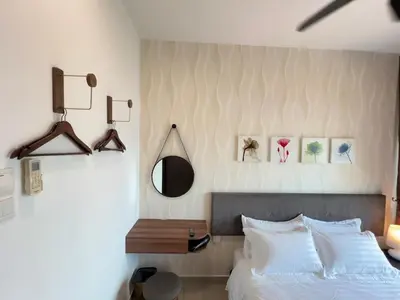 a bedroom with a bed and a mirror on the wall at G Home 3 - Ipoh City Centre Majestic 2R2B in Ipoh