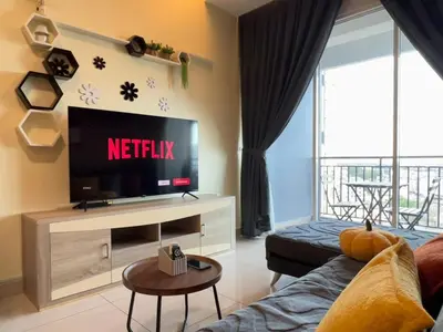 a living room with a tv and a couch at G Home 3 - Ipoh City Centre Majestic 2R2B in Ipoh