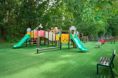 a park with a playground with a slide at DamaiNest in Lumut