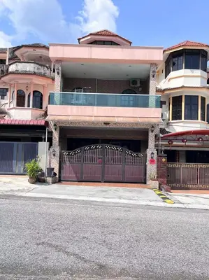 a house with a red gate on a street at Menglembu Hill Home Stay in Ipoh