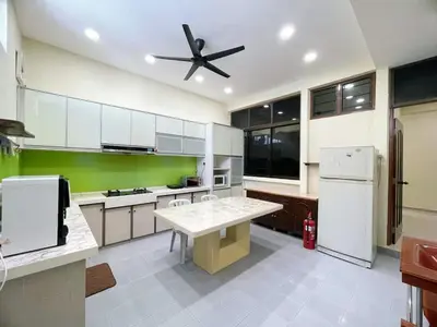 a kitchen with white appliances and a ceiling fan at Vintage CoLiving 2Storey Haus in Bukit Mertajam