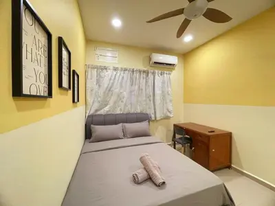 a bedroom with a bed and a ceiling fan at Vintage CoLiving 2Storey Haus in Bukit Mertajam