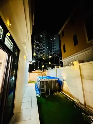 a view of a building at night with lights at Batu Ferringhi Home Near Beach in Penang with private pool in Batu Ferringhi