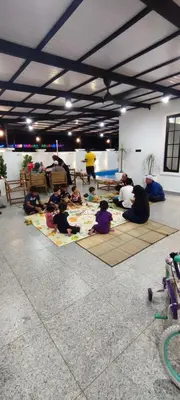 a group of people sitting on the floor in a room at Akasea Sojourn in Gua Sai