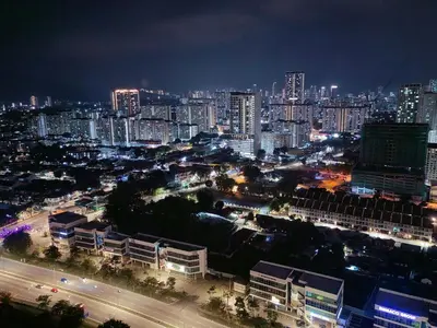 a city lit up at night with buildings at Urban Suites Jelutong Georgetown 2BR Leisure City Night View in Jelutong