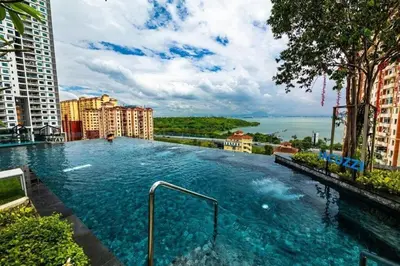 a large swimming pool on top of a building at Urban Suites Jelutong Georgetown 2BR Leisure City Night View in Jelutong