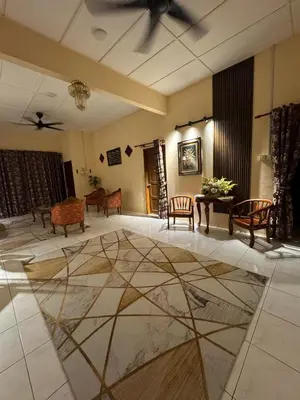 a lobby with a marble floor and a ceiling at Casa de' Sara Pool Homestay Ipoh in Ipoh