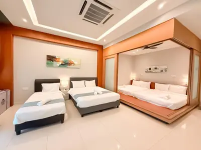 a bedroom with two beds and a mirror at Fairy 2 Pool Villa Ipoh 26 Pax Kbox Snooker Lego in Ipoh